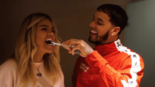 Karol G Brushes Teeth With Someone GIF