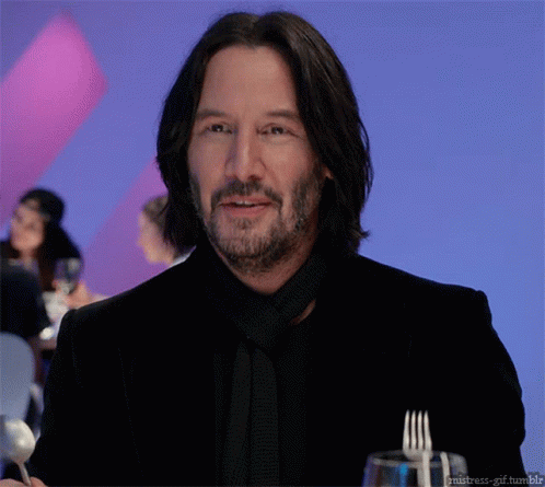 Keanu Reeves With Fork And Spoon GIF