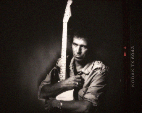 Keith Richards Cuddling Guitar Album Cover GIF