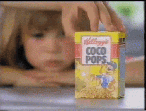 Kellogg's Coco Pops Box Next To Child GIF