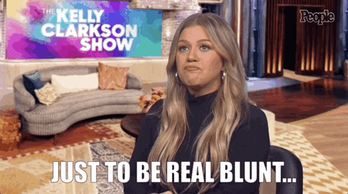 Kelly Clarkson Says Just To Be Real Blunt In Front Of A Couch GIF