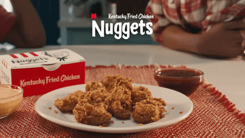 Kentucky Fried Chicken Nuggets Next To Plate GIF