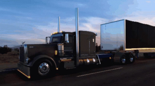 Kenworth Semi Truck Driving Down Road