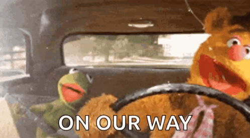Kermit The Frog And Fozzie Bear Are Driving A Car With The Words On Our Way Written On The Side GIF