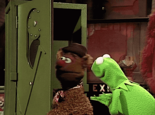 Kermit The Frog And Fozzie Bear Are Looking Out Of A Green Box GIF