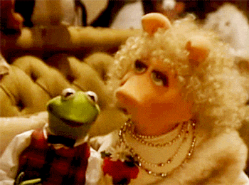 Kermit the Frog and Miss Piggy Sitting Together