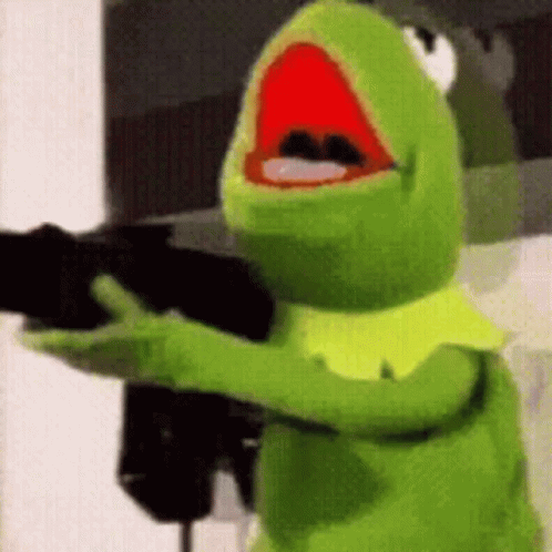 Kermit The Frog From The Muppet Show Is Holding A Gun In His Hand . GIF