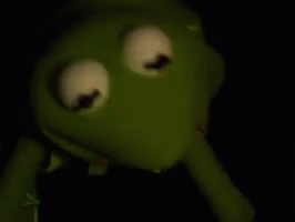 Kermit The Frog From The Muppet Show Is Holding A Syringe In His Mouth . GIF