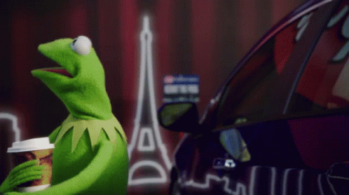 Kermit The Frog Holding Coffee In Front Of Purple Car GIF