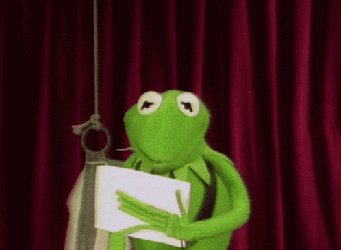 Kermit The Frog Is Holding A Piece Of Paper In His Hands GIF