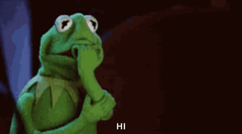 Kermit The Frog Is Holding His Hand To His Mouth And Says Hi . GIF