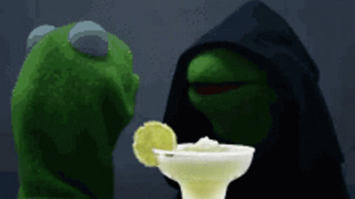Kermit The Frog Is Looking At A Margarita With A Slice Of Lime In It GIF