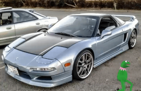 Kermit The Frog Is Standing Next To A Sports Car GIF