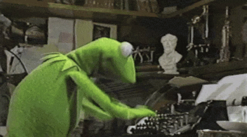 Kermit The Frog Is Typing On A Typewriter . GIF