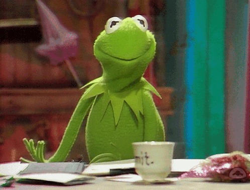 Kermit the Frog Sitting at Table with MIT Cup
