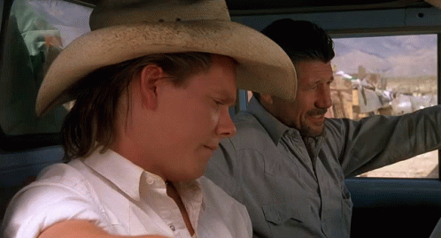 Kevin Bacon And Fred Ward Intense Gaze GIF