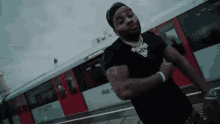 Kevin Gates On Railway Flexing Muscles GIF