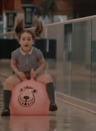 Kid And Pink Hooper Bouncing Ball GIF