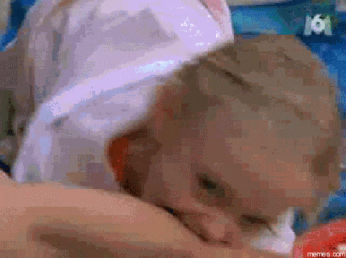 Kid Bites Boy's Leg GIF