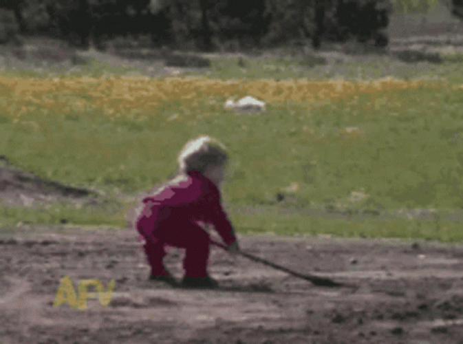 Kid Digging Spilling Soil In His Face GIF