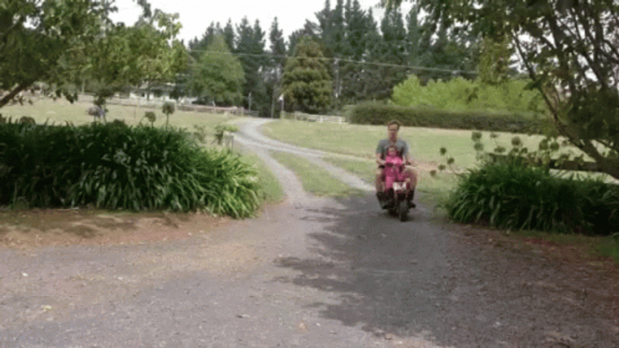 Kid Enjoying Slow Bike Ride GIF
