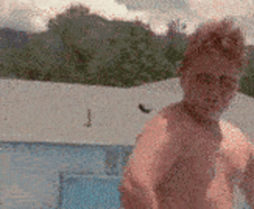 Kid Flexing Before Cannonball Dive GIF