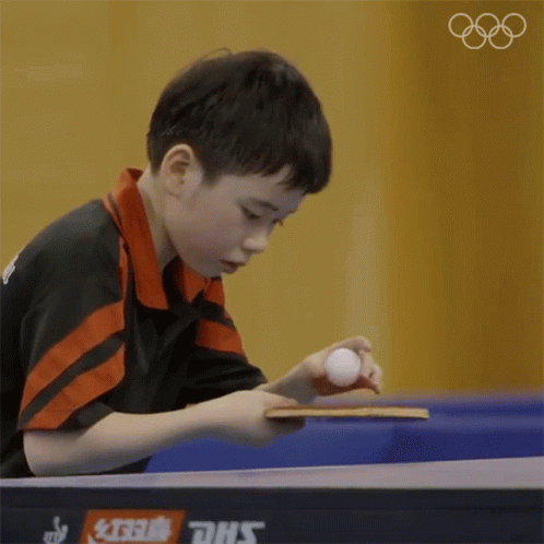 Kid Focus Playing Table Tennis GIF