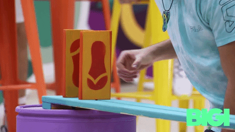 Kid Lining Up Domino Tiles GIF