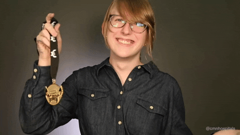 Kid Thumbs Up On Medal GIF