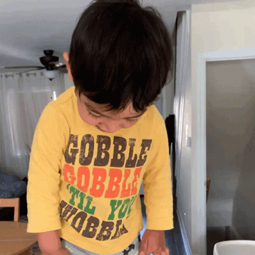 Kid Wearing Gobble Gobble Shirt GIF