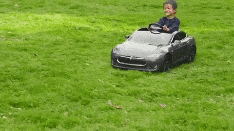 Kids Driving Toy Cars On Road GIF