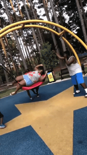 Kids Falling Over Swing GIF