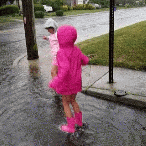 Kids Jumping In Rain Water GIF