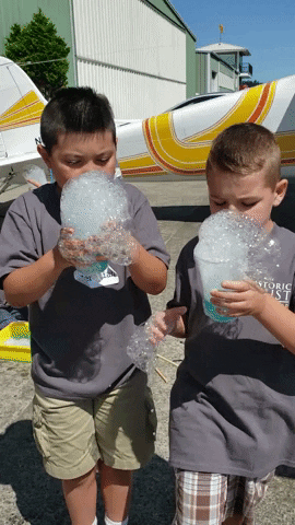 Kids Learning To Make Bubbles GIF