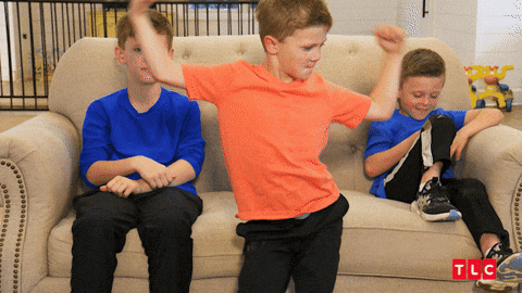 Kids On Couch Young Boy Showing Off GIF