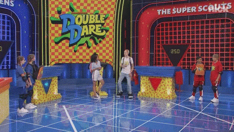 Kids Standing On Stage In Front Of Double Dare Sign GIF