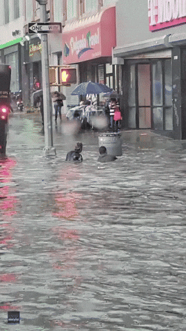 Kids Swimming In Monsoon Flood GIF