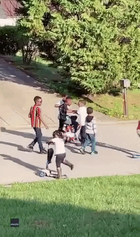 Kids Teaching Their Friend Riding Bike GIF