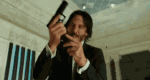 Kill Keanu Reeves Loading Gun GIF