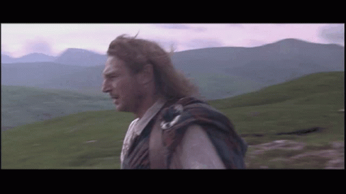 Kilted Man Playing Bagpipe Beside Another Kilted Man GIF