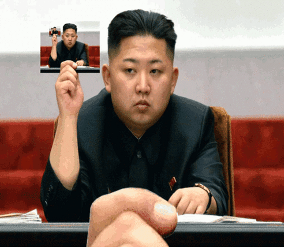 Kim Jong Un Holding His Picture Loop GIF