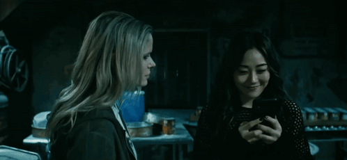 Kimiko Showing Message To A Friend GIF