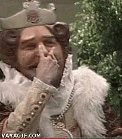King Covering Mouth While Smoking