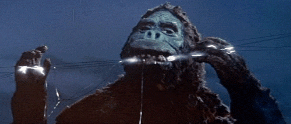 King Kong Biting On Power Lines Old Movie GIF