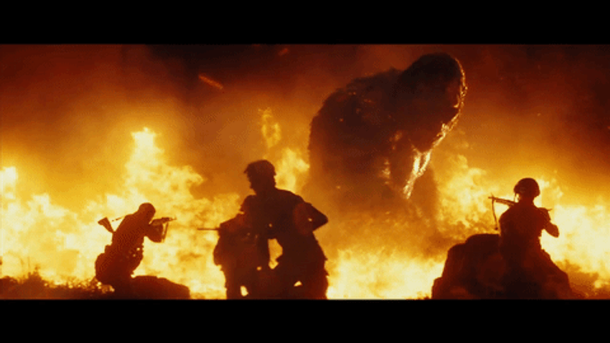 King Kong Fighting Soldiers On Burning Flames GIF