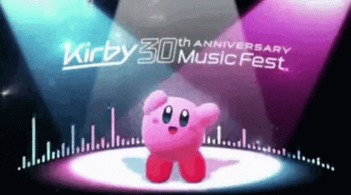 Kirby Is Dancing On A Stage In Front Of A Spotlight At The Kirby 30Th Anniversary Music Fest . GIF