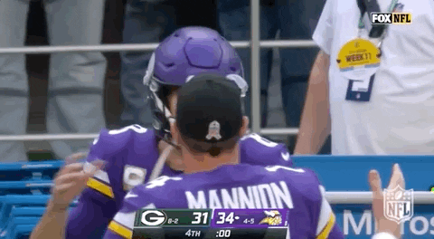 Kirk Cousins Sean Mannion Tap Hug Back GIF