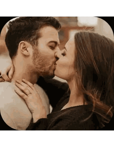 Kissing Couple Woman Wearing Ring