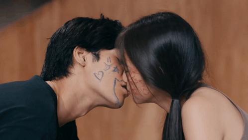 Kissing Man And Woman With Heart Faces GIF