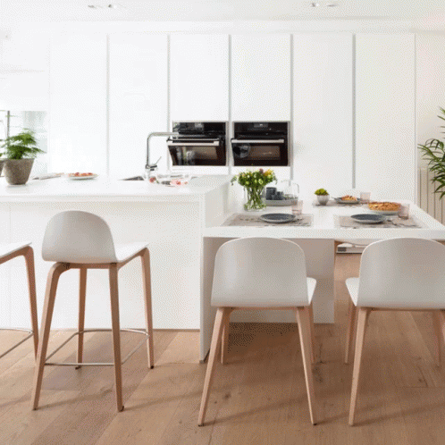 Kitchen Table and Chairs With Plates and Utensils